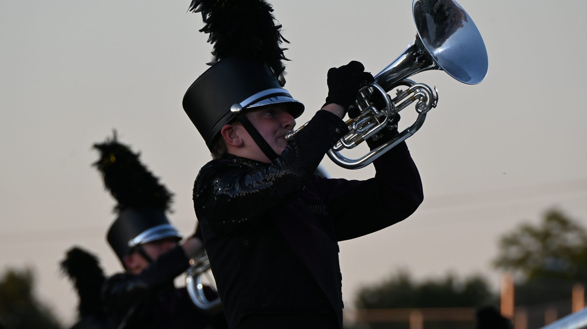 Boise Gems horn player performing at dusk